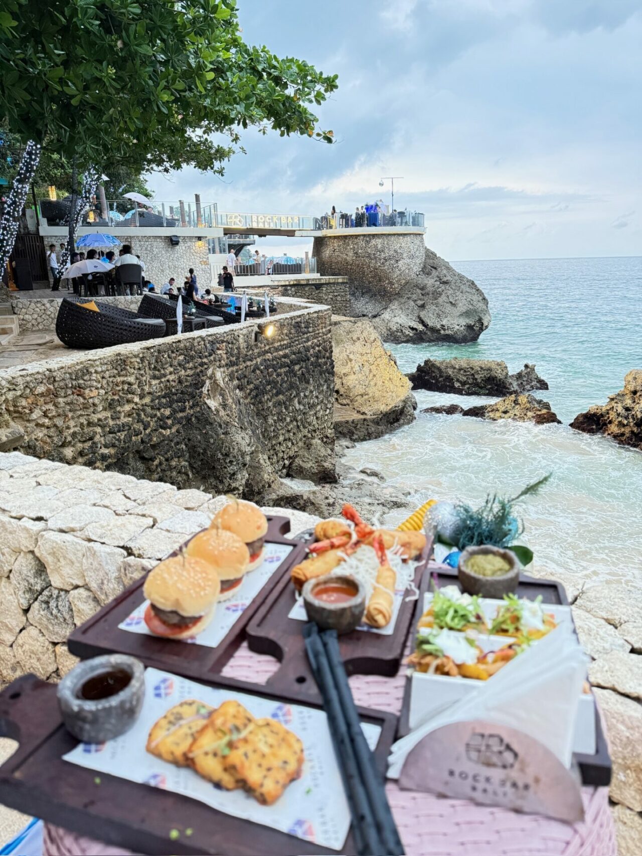 new year's eve food at the rock bar ayana resort bali overlooking the ocean